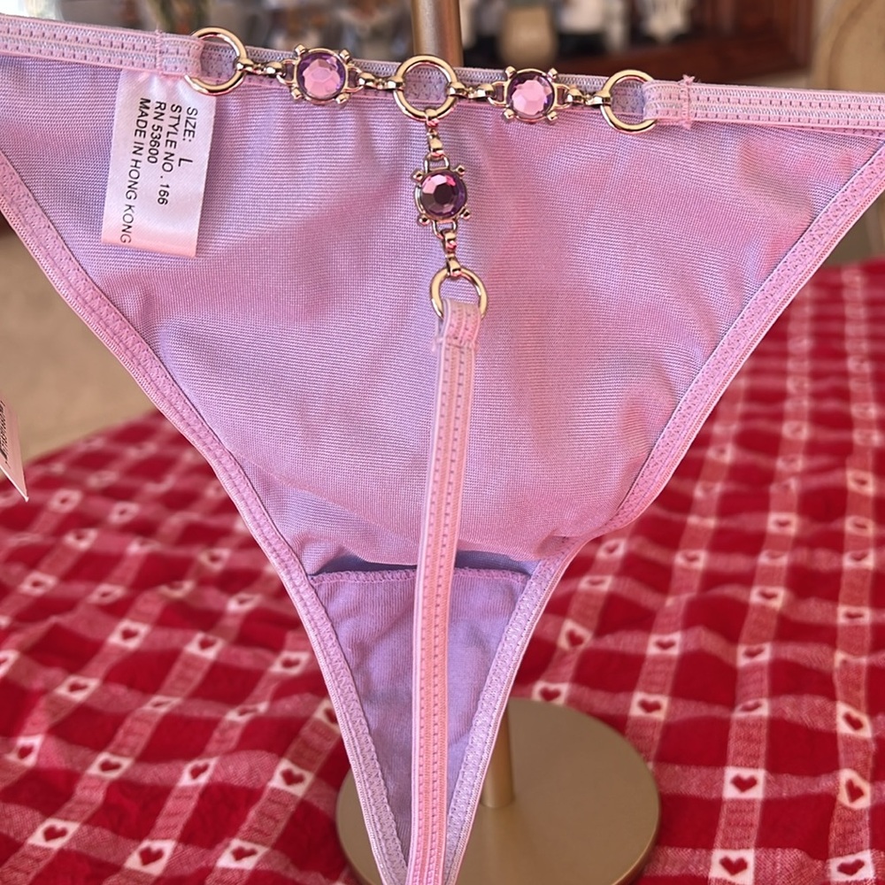 NWT lavender satin size large thongs. Purple stones on back. Beautiful